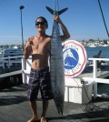 Fullerton resident Eric Kim poses with the wahoo he reeled in. (Courtesy of the Balboa Angler Club)
