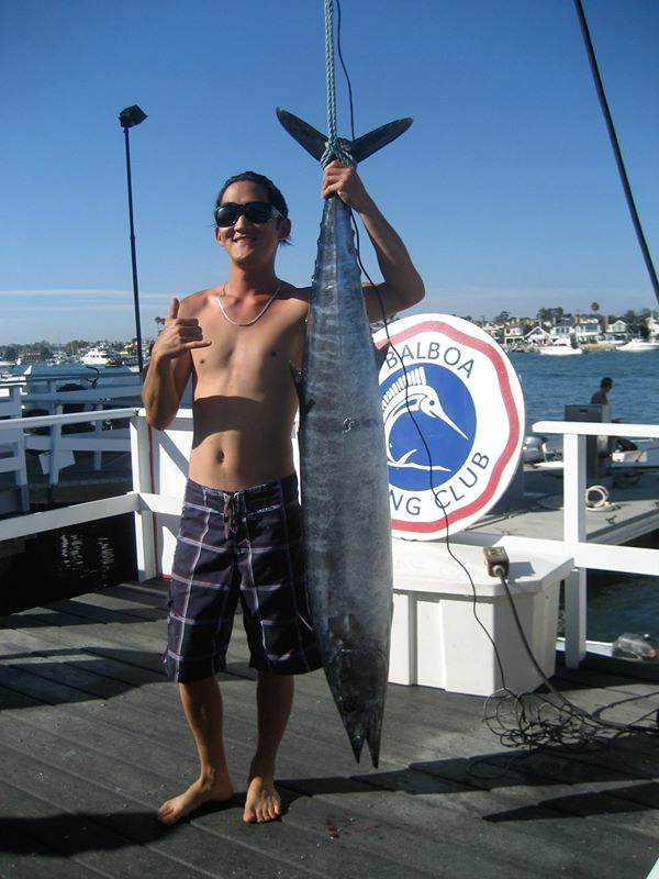 Fullerton resident Eric Kim poses with the wahoo he reeled in. (Courtesy of the Balboa Angler Club)