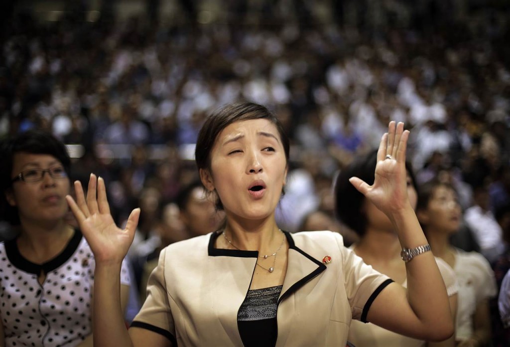 A North Korean woman reacts while watching a pro wrestling exhibition, on Aug. 31 in Pyongyang. In Pyongyang, where the standard of living is relatively high, clothes and styles have been changing in recent years - slowly and in a limited way, but more than many outsiders might think. (AP Photo/Wong Maye-E)(AP)