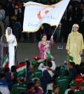 Rita Subowo, middle, President of National Olympics Committee of Indonesia, holds the Olympic Council of Asia flag during the closing ceremony for the 17th Asian Games in Incheon, South Korea, Saturday, Oct. 4, 2014. (Yonhap)