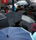 Rain couldn't stop Koreans from getting their iPhones. (Yonhap)