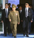 Hwang Pyong So, center left, vice chairman of North Korea’s National Defense Commission, and Choe Ryong Hae, center right, a secretaries of the North Korea’s ruling Workers Party, arrive at the Incheon International Airport in Incheon, South Korea, Saturday, Oct. 4, 2014. Choe  and other senior officials visited to the South Korea on Saturday for the close of the Asian Games sporting event, South Korean officials said, a rare visit by Pyongyang's inner circle that will include a meeting with Seoul's top official for North Korean affairs.(AP Photo/Yonhap, Kim Do-hoon)