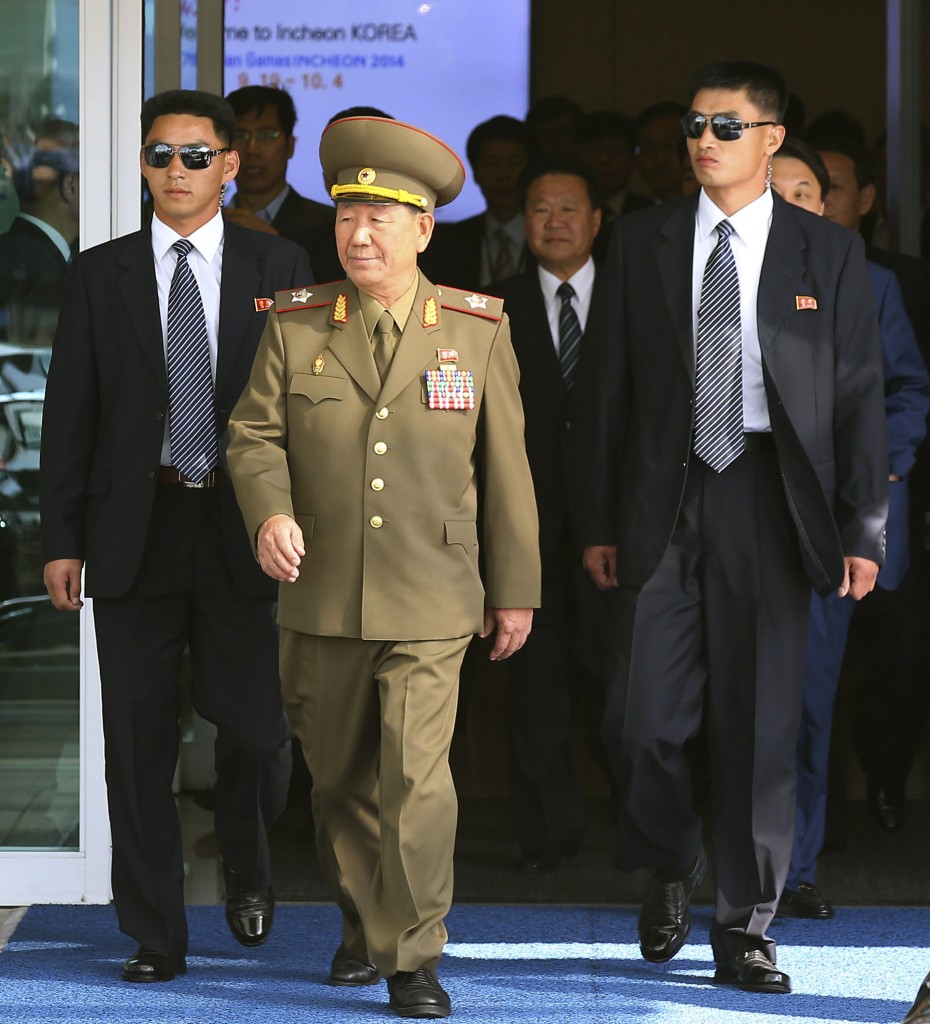 Hwang Pyong So, center left, vice chairman of North Korea’s National Defense Commission, and Choe Ryong Hae, center right, a secretaries of the North Korea’s ruling Workers Party, arrive at the Incheon International Airport in Incheon, South Korea, Saturday, Oct. 4, 2014. Choe  and other senior officials visited to the South Korea on Saturday for the close of the Asian Games sporting event, South Korean officials said, a rare visit by Pyongyang's inner circle that will include a meeting with Seoul's top official for North Korean affairs.(AP Photo/Yonhap, Kim Do-hoon) 