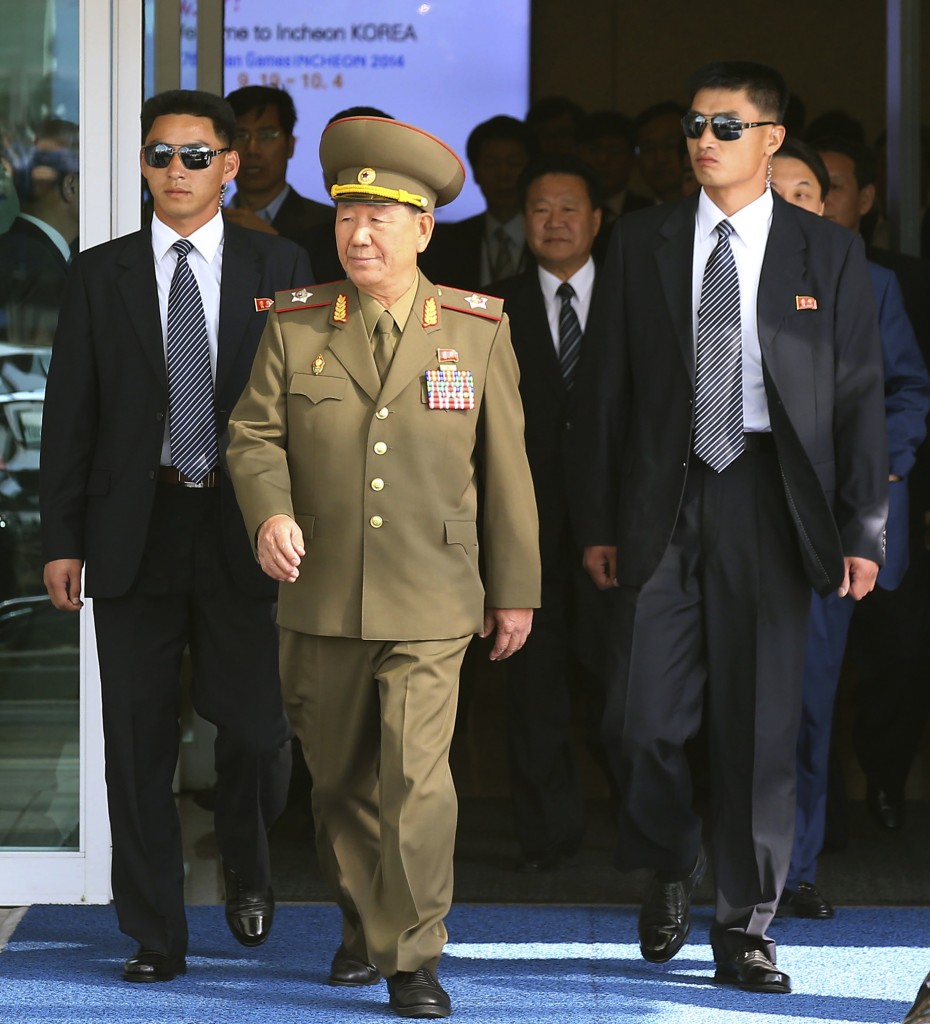 Hwang Pyong So, center left, vice chairman of North Korea’s National Defense Commission, and Choe Ryong Hae, center right, a secretaries of the North Korea’s ruling Workers Party, arrive at the Incheon International Airport in Incheon, South Korea, Saturday, Oct. 4, 2014. Choe and other senior officials visited to the South Korea on Saturday for the close of the Asian Games sporting event, South Korean officials said, a rare visit by Pyongyang's inner circle that will include a meeting with Seoul's top official for North Korean affairs.(AP Photo/Yonhap, Kim Do-hoon)