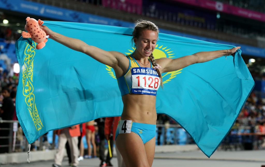 Kazkhstan's Olga Safronova celebrates as she wins the women's 200m final at the 17th Asian Games in Incheon, South Korea,  Wednesday, Oct. 1, 2014.(AP Photo/Rob Griffith)