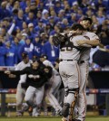 San Francisco Giants' Madison Bumgarner and catcher Buster Posey celebrate after Game 7 of baseball's World Series against the Kansas City Royals Wednesday, Oct. 29, 2014, in Kansas City, Mo. The Giants won 3-2 to win the series. (AP Photo/David J. Phillip)
