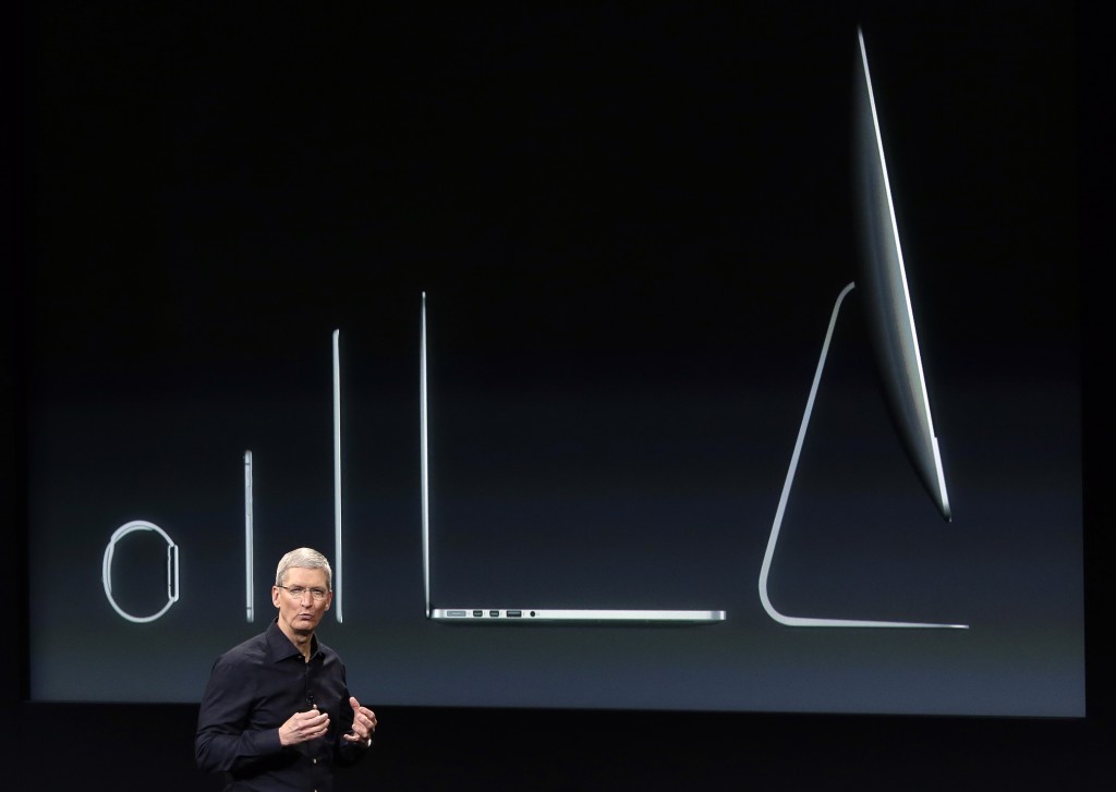 Apple CEO Tim Cook discusses the new Apple product line-up during an event at Apple headquarters on Thursday, Oct. 16, 2014 in Cupertino, Calif. (AP Photo/Marcio Jose Sanchez)