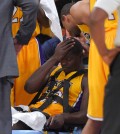 Los Angeles Lakers forward Julius Randle, right, sits on on a stretcher after Randle injured himself on a play during the second half of an NBA basketball game, Tuesday, Oct. 28, 2014, in Los Angeles. (AP Photo/Mark J. Terrill)