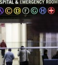 People walk through the lobby of Bellevue Hospital, Friday, Oct. 24, 2014, in New York. Dr. Craig Spencer, a resident of New York City and a member of Doctors Without Borders, was admitted to Bellevue on Thursday and has been diagnosed with Ebola. (AP Photo/Mark Lennihan)