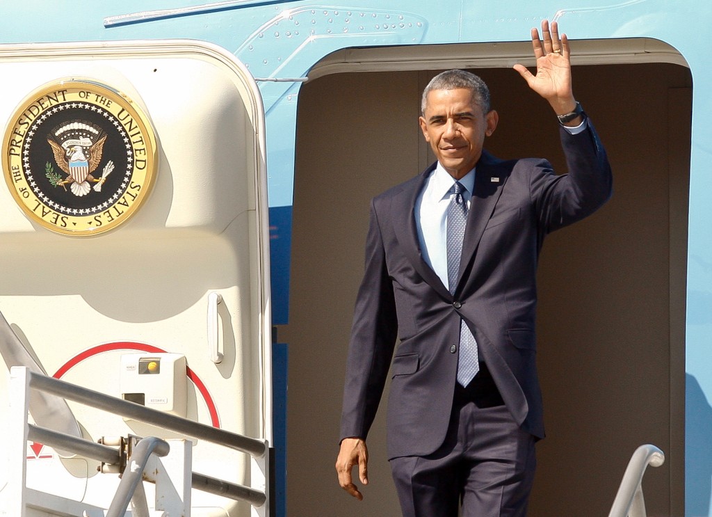 President Barack Obama steps off of Air Force One at Los Angeles International Airport, Thursday, Oct. 9, 2014, in Los Angeles. (AP Photo/Damian Dovarganes)