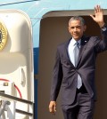 President Barack Obama steps off of Air Force One at Los Angeles International Airport, Thursday, Oct. 9, 2014, in Los Angeles. (AP Photo/Damian Dovarganes)