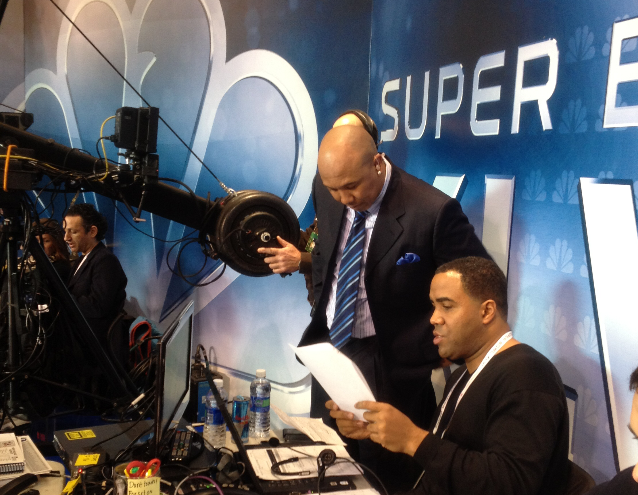 Hines Ward goes over production notes before a Superbowl broadcast (Courtesy of Andrew Ree)