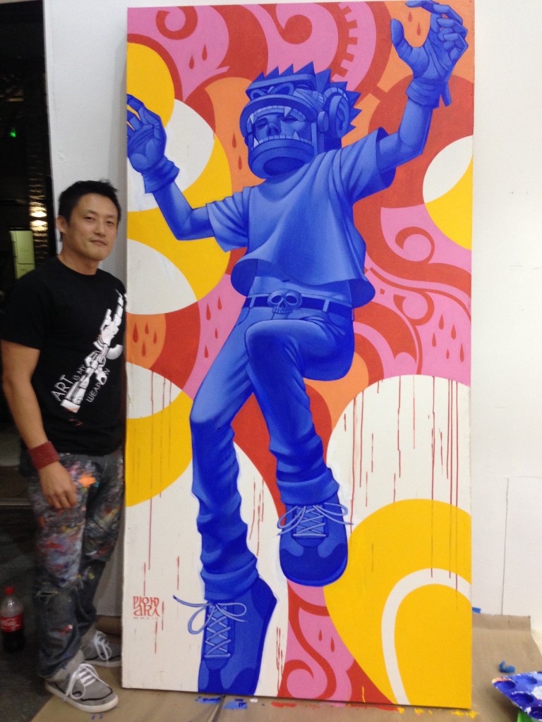 Park stands next to a piece that is part of his latest series of paintings titled "Gorilla Warfare"