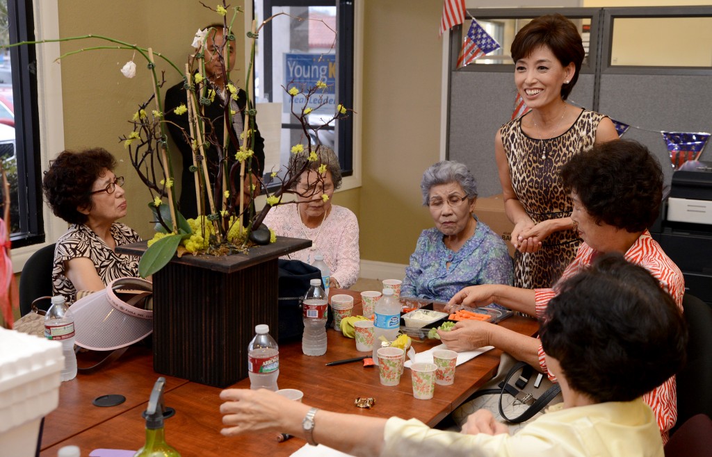 Young Kim meets with community members.