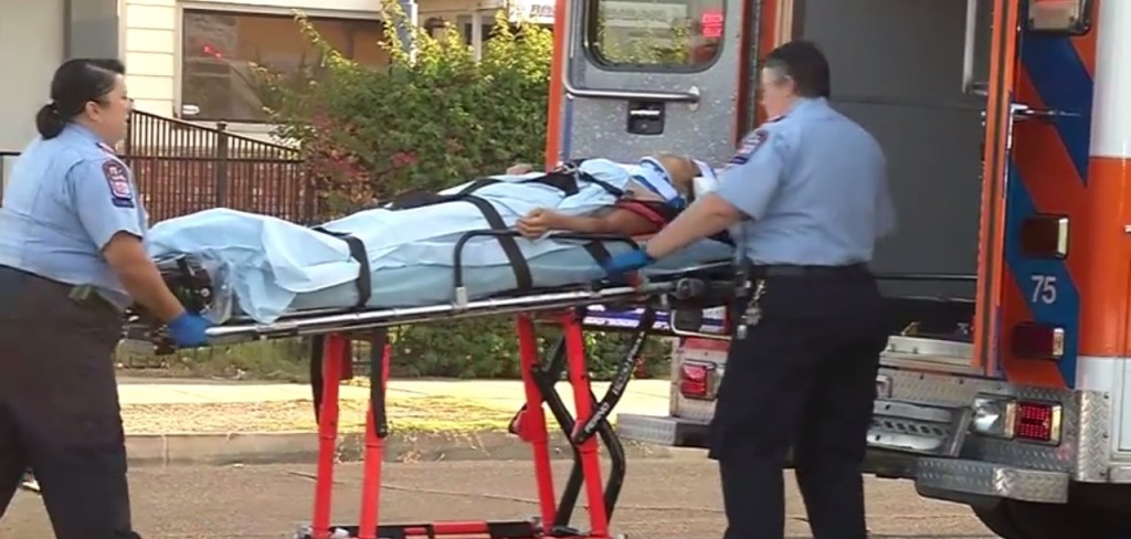 A female victim is being transported to hospital. (KBFX-TV screen capture)