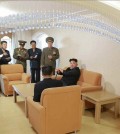 North Korean leader Kim Jong-un with a cane sits on a couch during a visit to a faculty flat at the Kim Chaek University of Technology in Pyongyang. (KCNA-Yonhap)