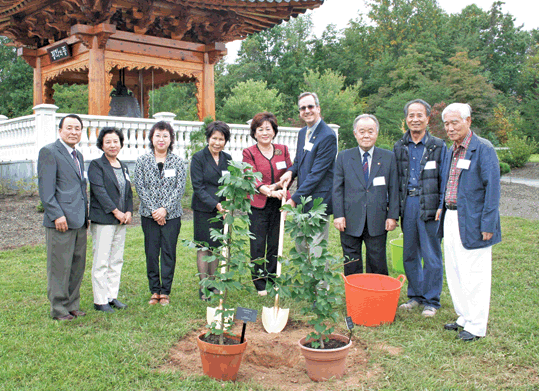 Representatives from the Northern Virginia Regional Park Authority, the Washington Korean Cultural Committee and Jeonju Lee Clan at a planting ceremony inside Korean Bell Garden. 