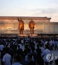 People gather a day before the 20th anniversary of former North Korean leader Kim Il-sung's death in Pyongyang. (Yonhap)