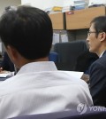 Kim, Lee's husband, and (Yonhap)