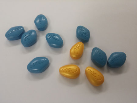 Blue-colored pills are counterfeit Viagra, and the yellow ones are counterfeit Cialis 500. (Korea Times)