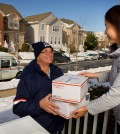 U.S. Postal Service letter carrier delivering packages during the holidays (PRNewsFoto/U.S. Postal Service)