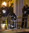 Tallahassee police investigate the scene of a shooting outside the Strozier library on the Florida State University campus in Tallahassee, Fla. Thursday Nov 20, 2014. Officers shot and killed the suspected gunman police said. It has been confirmed by authorities that the body in this image is that of the dead gunman. There were no other fatalities in the shooting. (AP Photo/Mark Wallheiser)