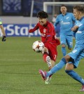 Leverkusen's Son Heung-min, center, tries to score during the Champions League group C soccer match between Zenit St. Petersburg and Bayer 04 Leverkusen in St.Petersburg, Russia, Tuesday, Nov. 4, 2014. (AP Photo/Dmitry Lovetsky)