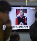 A TV screen shows Kim Yo Jong, North Korean leader Kim Jong Un's younger sister, at Seoul Railway Station in Seoul, South Korea, Thursday, Nov. 27, 2014. North Korea has revealed that Kim is a senior official in the ruling Workers' Party, strengthening analysts' views that she is an increasingly important part of the family dynasty that runs the country. The letters read "Kim Jong Un's sister". (AP Photo/Ahn Young-joon)