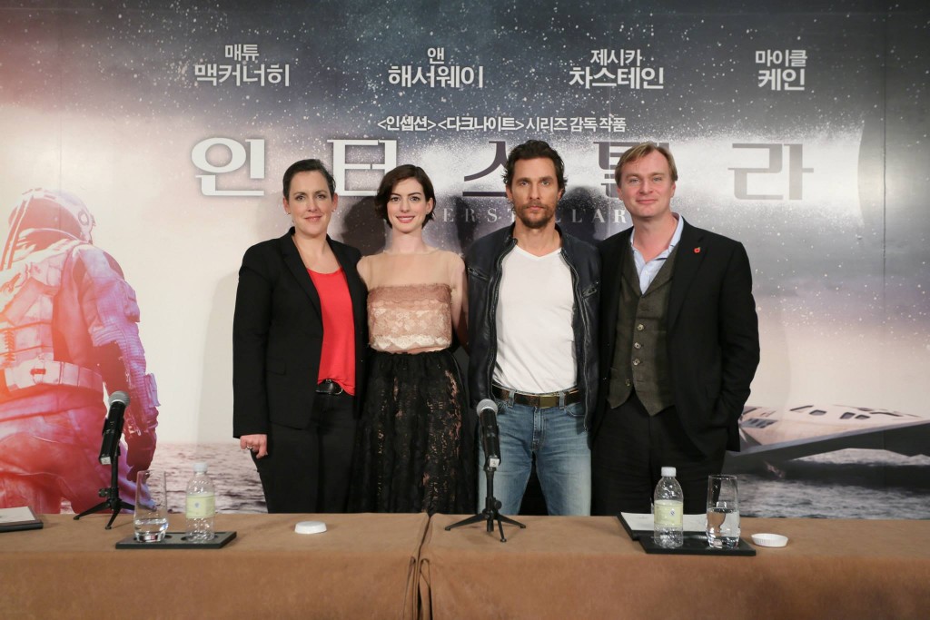 From the right, director Christopher Nolan and actors Matthew McConaughey and Anne Hathaway of the American sci-fi film "Interstellar" pose for photographers during a news conference held at a Shanghai hotel on Nov. 10, 2014, to promote the film. (Yonhap)