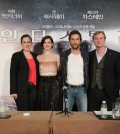 From the right, director Christopher Nolan and actors Matthew McConaughey and Anne Hathaway of the American sci-fi film "Interstellar" pose for photographers during a news conference held at a Shanghai hotel on Nov. 10, 2014, to promote the film. (Yonhap)