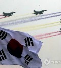 Fighter jets fly overhead at an event at the Gyeryongdae military headquarters in Gyeryong, South Chungcheong Province, on Sept. 30, 2014, ahead of the 66th anniversary of the foundation of the country's military, which falls on Oct. 1. (Yonhap)