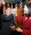 Irvine Mayor Choi Seok-ho, left, and Orange County Supervisor Michelle Park Steel celebrate their general election victories Tuesday night. (Park Sang-hyuk/The Korea Times)