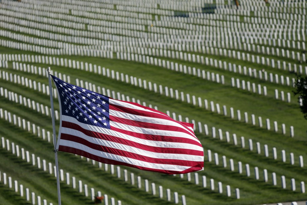  A U.S. Flag flies over war veterans tombstones at Golden Gate National Cemetery in San Bruno, Calif. (AP)