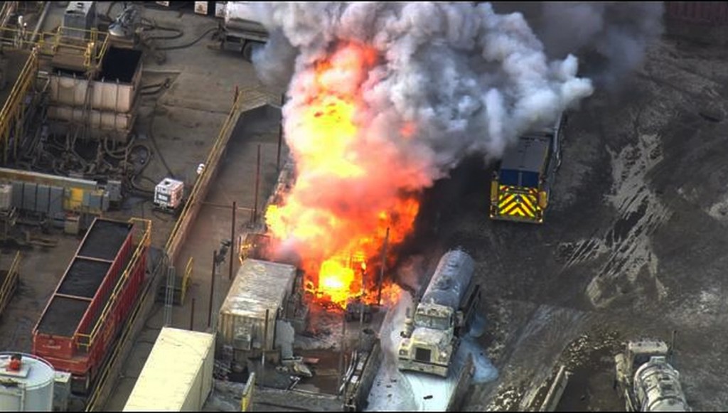 In this aerial still frame from video provided by Fox 11 LA, a waste treatment facity burns after an unstable chemical mixture exploded in Santa Paula, Calif., early Tuesday, Nov. 18, 2014, sending about 30 people to the hospital for decontamination and prompting an order to evacuate for a mile around the plant, authorities said. No burn injuries were reported, but two drivers on a vacuum truck, three firefighters, hospital medical staff and a few nearby residents were washed down or treated for complaints such as breathing problems, red eyes and skin rashes, said Lori Ross, a spokeswoman for the Ventura County Fire Department. The vacuum truck was delivering a load around 3:45 a.m. when it exploded at the Santa Clara Waste Water Co., authorities said. (AP Photo/Fox 11 LA)