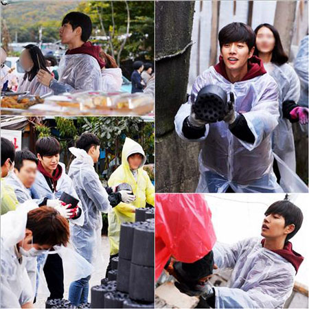 Park Hae-jin hustles with rumormongers delivering briquettes for residents of Guryong village in Seoul. (Yonhap) 