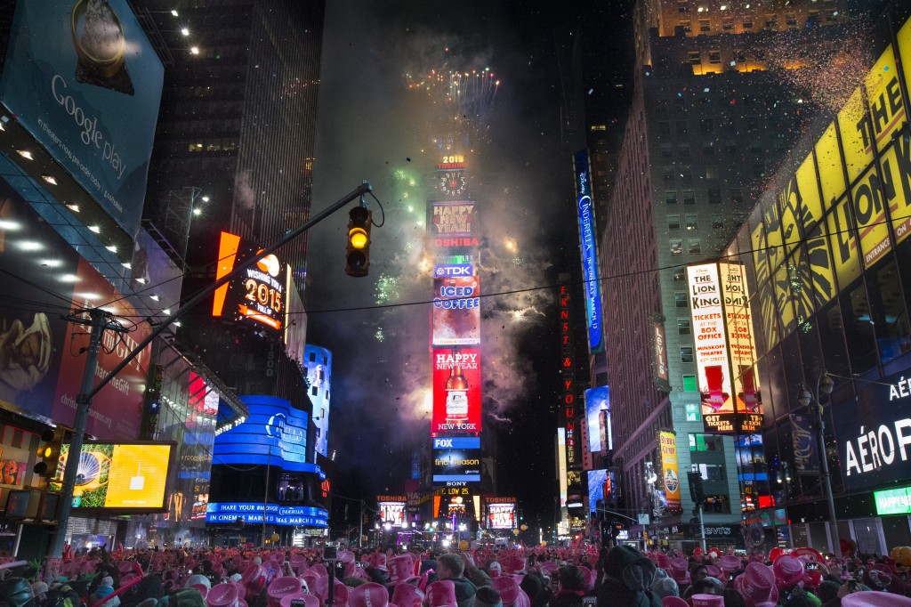 Fireworks erupt after midnight in Times Square during the New Year's Eve celebration, Thursday, Jan. 1, 2015, in New York. Thousands braved the cold to watch the annual ball drop and ring in the new year. (AP Photo/John Minchillo)