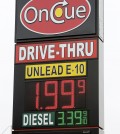 A sign displays the price for E-10 gasoline for $1.99 at the OnCue convenience store and gas station, Wednesday, Dec. 3, 2014, in Oklahoma City. (AP Photo/The Oklahoman, Paul B. Southerland)