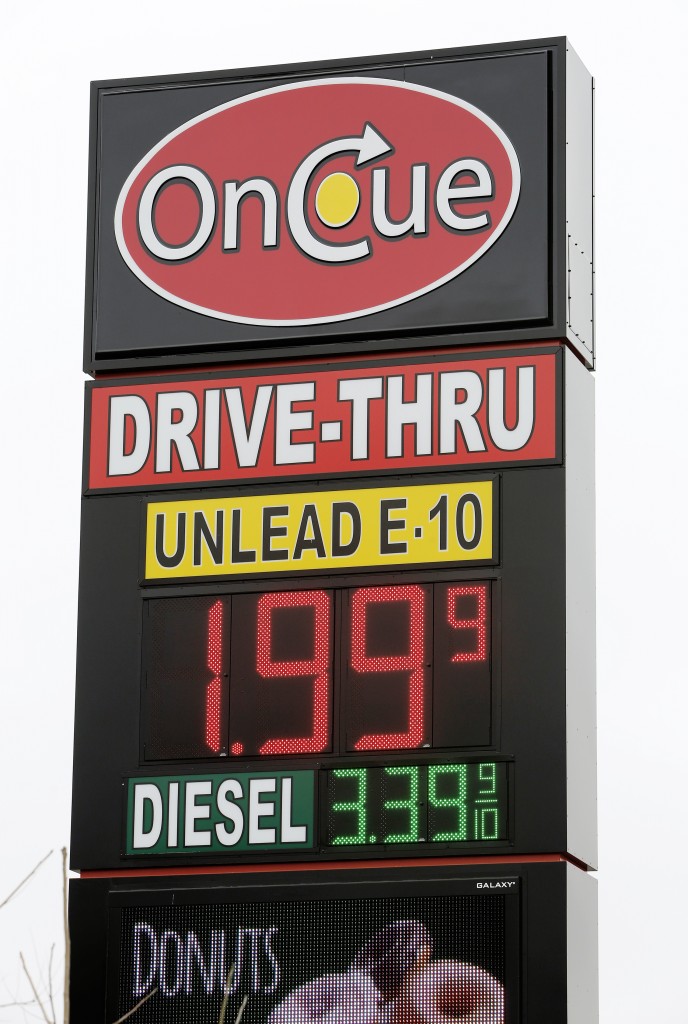 A sign displays the price for E-10 gasoline for $1.99 at the OnCue convenience store and gas station, Wednesday, Dec. 3, 2014, in Oklahoma City. (AP Photo/The Oklahoman, Paul B. Southerland)  