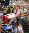 Teresa Clark fills an order at the Amazon fulfillment center in Lebanon, Tenn. on Monday, Dec. 1, 2014. Retailers rolled out discounts and free shipping deals on Cyber Monday, with millions of Americans expected to log on and shop on their work computers, laptops and tablets after the busy holiday shopping weekend. (AP Photo/Mark Humphrey)