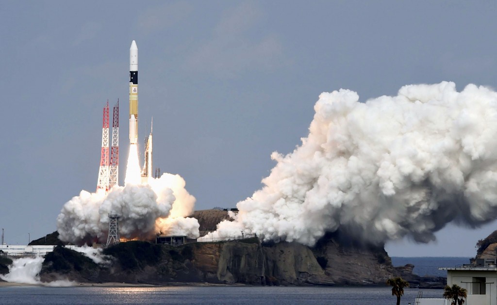 An H2-A rocket carrying space explorer Hayabusa2, lifts off from a launching pad at Tanegashima Space Center in Kagoshima, southern Japan, Wednesday, Dec. 3, 2014. The Japanese space explorer was launched Wednesday on a six-year roundtrip journey to blow a crater in a remote asteroid and collect samples from inside in hopes of gathering clues to the origin of earth. (AP Photo/Kyodo News)