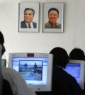 North Korean students use computers in a classroom with portraits of the country's later leaders Kim Il-sung, left, and his son Kim Jong-il hanging on the wall at the Kim Chaek University of Technology in Pyongyang, North Korea. Key North Korean websites were back online Tuesday, Dec. 23, 2014 after an hours-long shutdown that followed a U.S. vow to respond to a cyberattack on Sony Pictures that Washington blames on Pyongyang. (AP Photo/Vincent Yu)