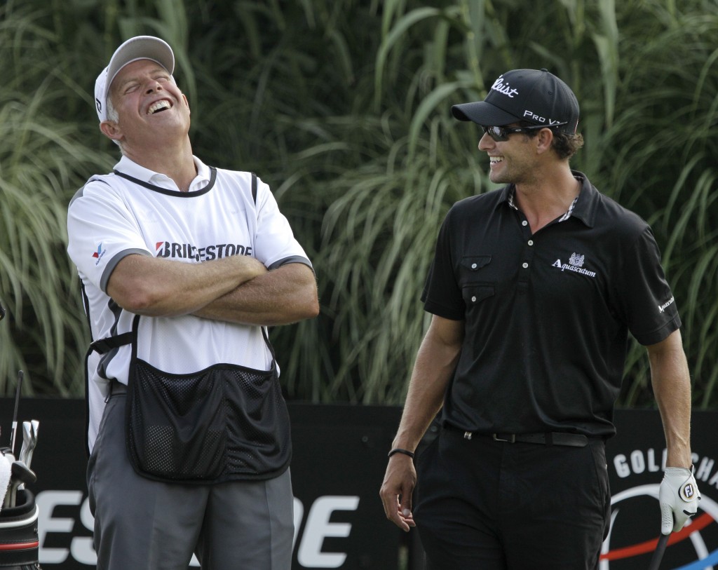 Adam Scott, right, had some good laughs with Steve Williams, but now Mike Kerr will be carrying his bag. (AP)