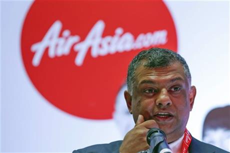 AirAsia Group Chief Executive Officer Tony Fernandes speaks during a press conference in Kuala Lumpur, Malaysia. Fernandes is more than just the CEO of AirAsia: He's the brash personality and cheerleader-like figure who gives the discount carrier its soul. A flamboyant executive who loves race cars and soccer - and is known for speaking his mind, sometimes inappropriately - Fernandes has opened air travel to millions who previously couldn’t afford it. Now, with one of his planes and 162 people onboard missing, Fernandes faces what he's calling his worst nightmare. (AP Photo/Vincent Thian)