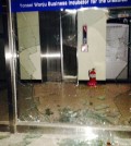The boar broke through the glass door of the entrance and proceeded to damage the elevator doors ahead of it. (Yonhap)