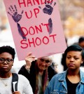 Demonstrators protest against the shooting death of unarmed 18-year-old Michael Brown, during a rally at the Department of Justice in Washington, Monday. (AP)