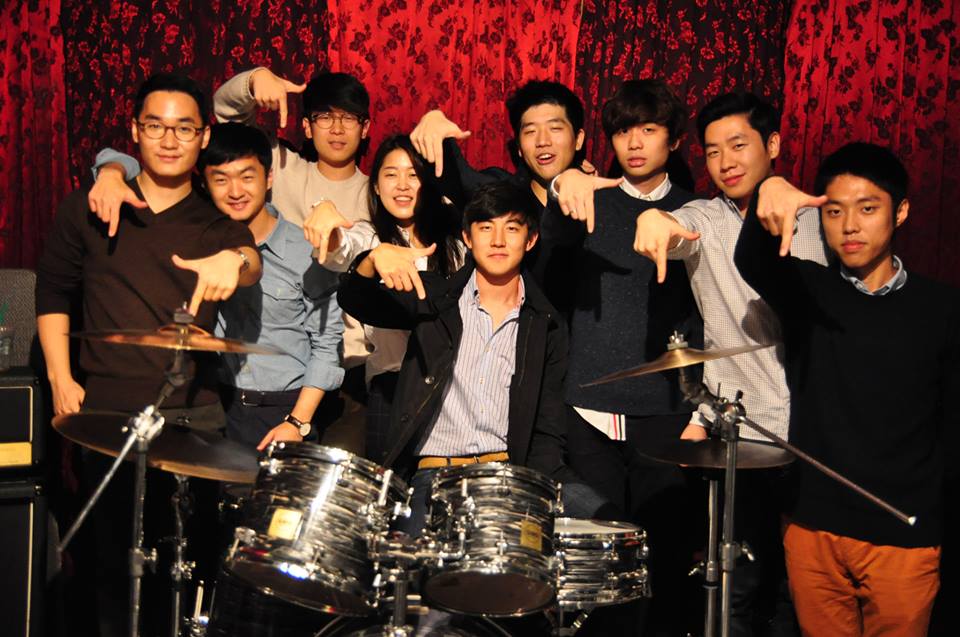 From left, Edward Soo-min Han (Keyboard), David Dong-jin Kim (Guitar), Andrew Sunghwan Kim (Vocal), Ashley JungAh Chung (Vocal), Marvin Won-bin So (Drum), Paul Jin-wang Yoo (Vocal), Philip Hyung-ho Shin (Guitar), Gerry Hyung-joo Nam (Bass), Alex Yeon-Sung Jung (Director, Manager)