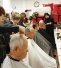 Volunteers provide free haircuts to seniors at the Korean American Community Services