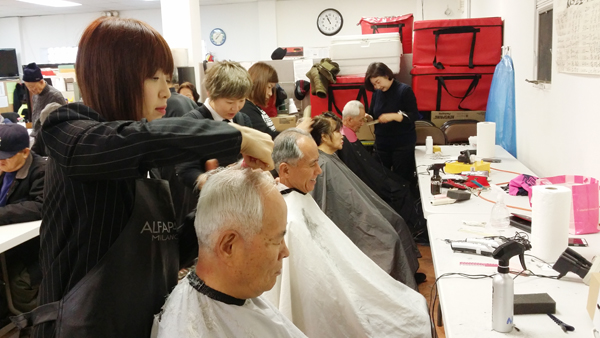 Volunteers provide free haircuts to seniors at the Korean American Community Services 