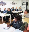 Korean language students at the Korean Cultural Center during a lesson.