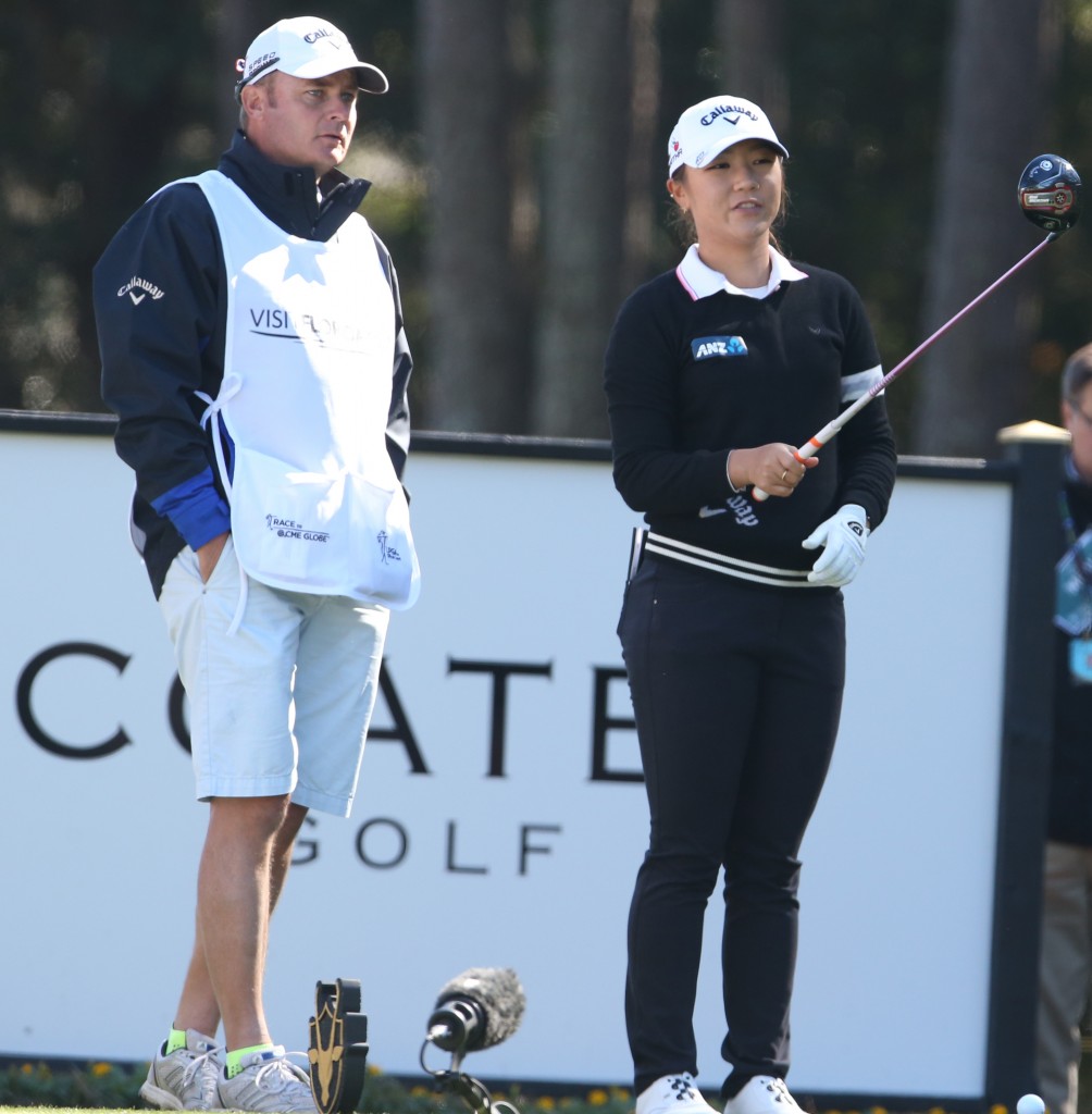 Lydia Ko, of New Zealand, talks with her caddie before teeing off on the 10th hole dduring the first round of the LPGA's Coates Golf Championship at Golden Ocala Golf and Equestrian Club in Ocala, Fla., on Wednesday, Jan. 28, 2015. (AP Photo/The Star-Banner Photo, Bruce Ackerman)